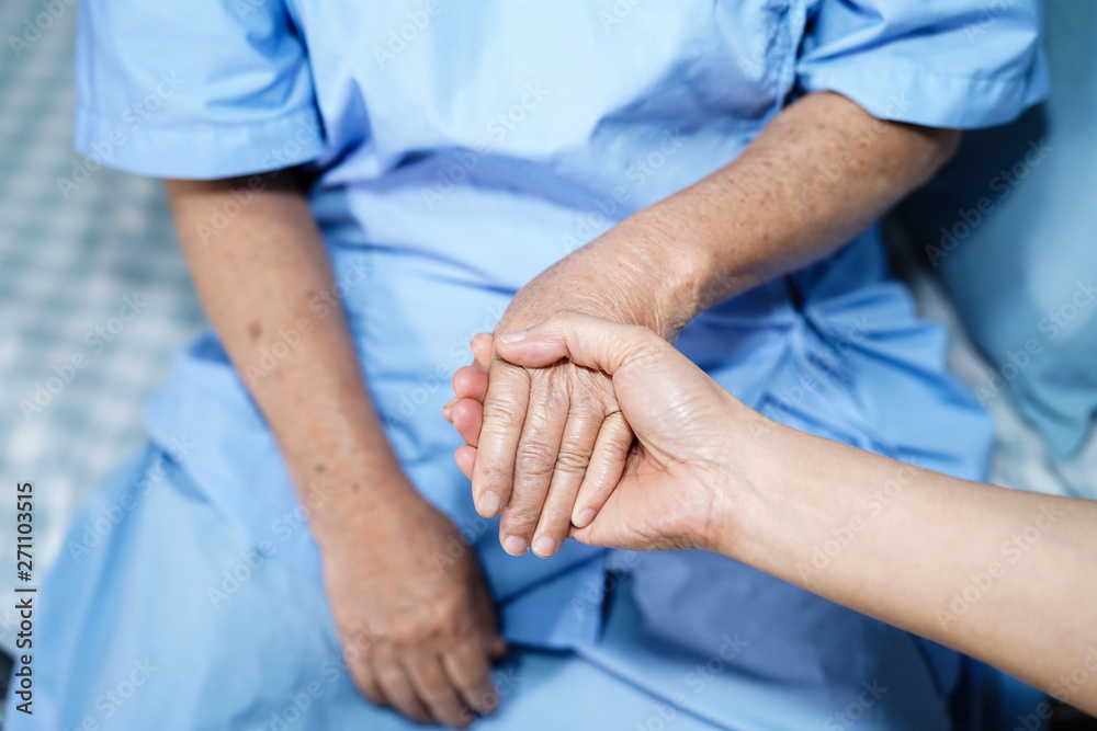 Holding Touching hands Asian senior or elderly old lady woman patient with love, care, helping, encourage and empathy at nursing hospital ward : healthy strong medical concept Holding Touching hands Asian senior or elderly old lady woman patient with love, care, helping, encourage and empathy at nursing hospital ward : healthy strong medical concept