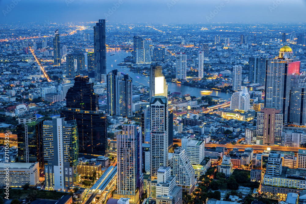 Skyline view of Bangkok business district at night time.