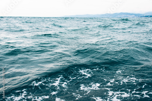 Fototapeta Naklejka Na Ścianę i Meble -  dark blue sea water background, waves of blue in black sea