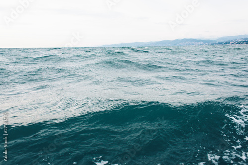 Fototapeta Naklejka Na Ścianę i Meble -  dark blue sea water background, waves of blue in black sea