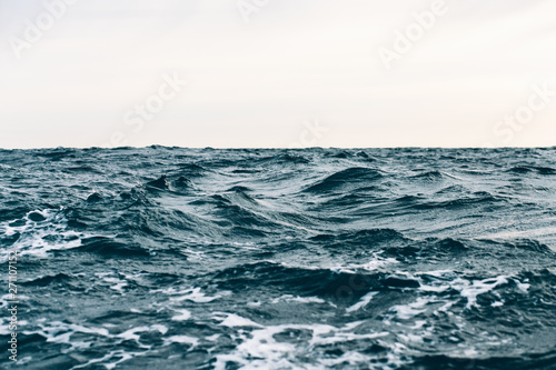 dark blue sea water background, waves of blue in black sea