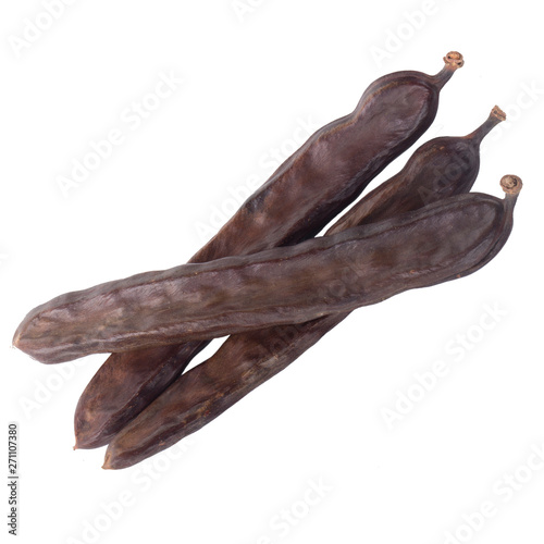 heap of carob isolated on white background