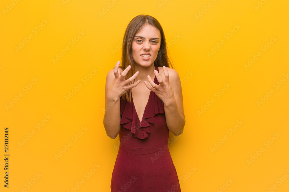 Young elegant woman wearing a dress angry and upset Young elegant woman wearing a dress angry and upset