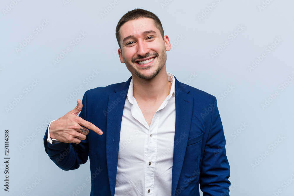 Young business caucasian man person pointing by hand to a shirt copy space, proud and confident Young business caucasian man person pointing by hand to a shirt copy space, proud and confident