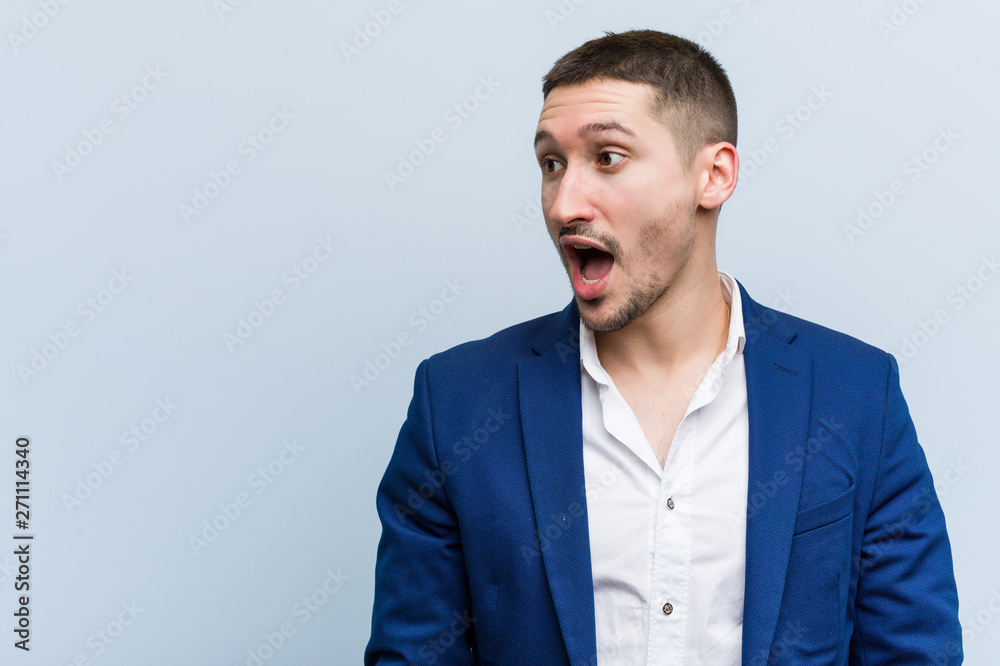 Young business caucasian man being shocked because of something she has seen. Young business caucasian man being shocked because of something she has seen.