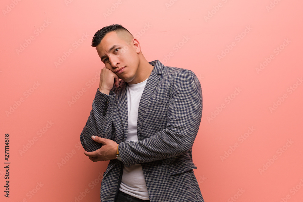 Young elegant latin man thinking of something, looking to the side