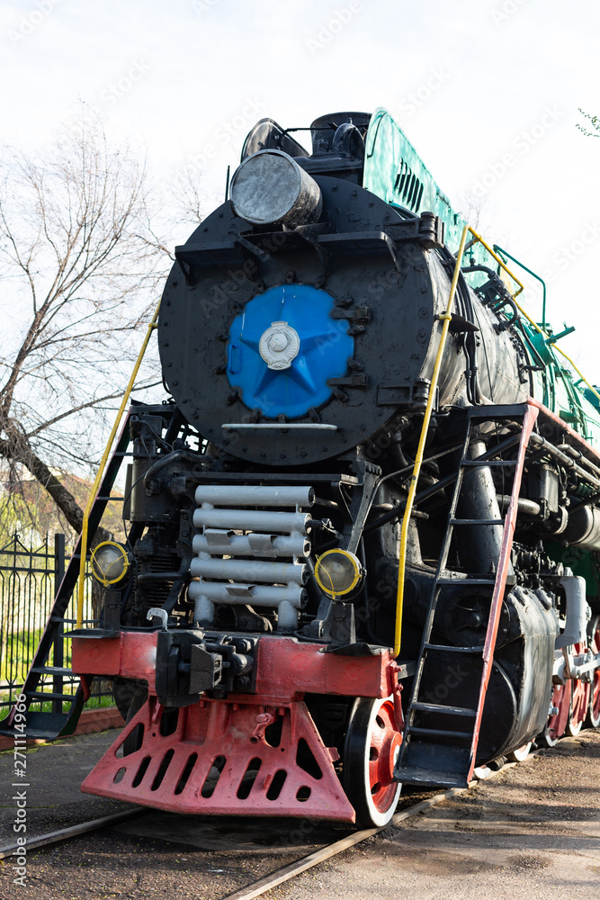 Obraz premium Ancient diesel locomotives. Retro locomotives .. Black locomotive. Green locomotive. Railway and trains.