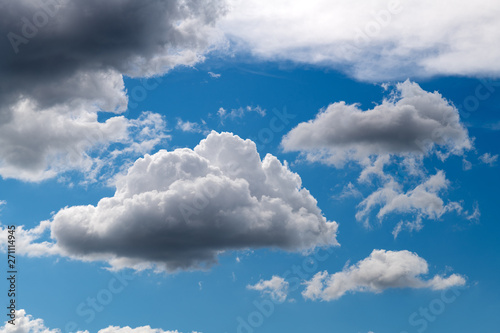 Beautiful white puffy cloudscape with blue sky