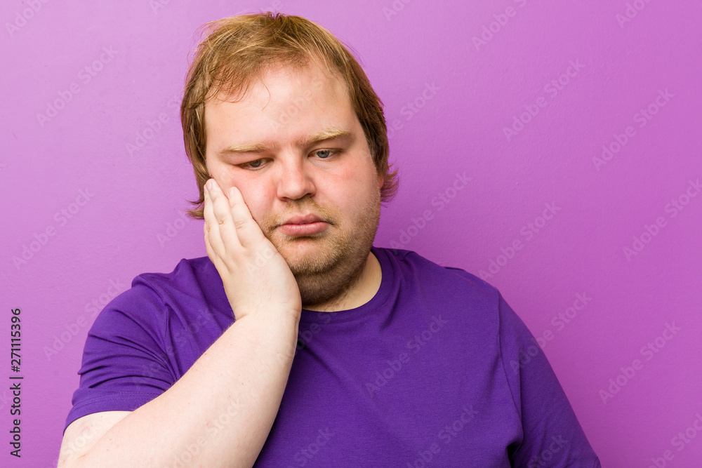 Young authentic redhead fat man who is bored, fatigued and need a relax day. Young authentic redhead fat man who is bored, fatigued and need a relax day.