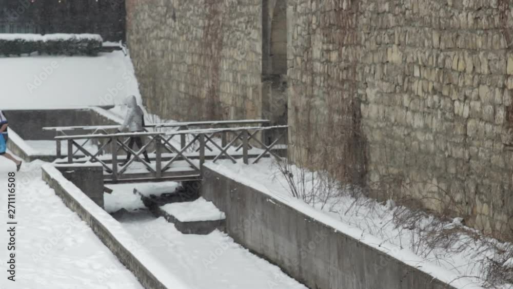 Winter is a wooden bridge,people go to the wooden bridge in winter Winter is a wooden bridge,people go to the wooden bridge in winter