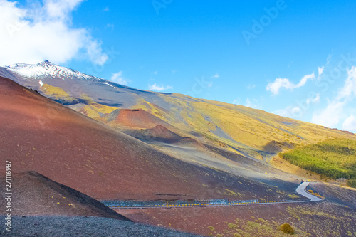 Impressive volcanic landscape surrounding the top of Mount Etna, Sicily, Italy captured with blue sky. Etna is the highest active volcano in Europe. Popular tourist spot photo