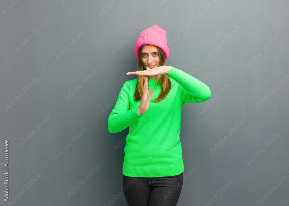 Young natural russian girl doing a timeout gesture Young natural russian girl doing a timeout gesture