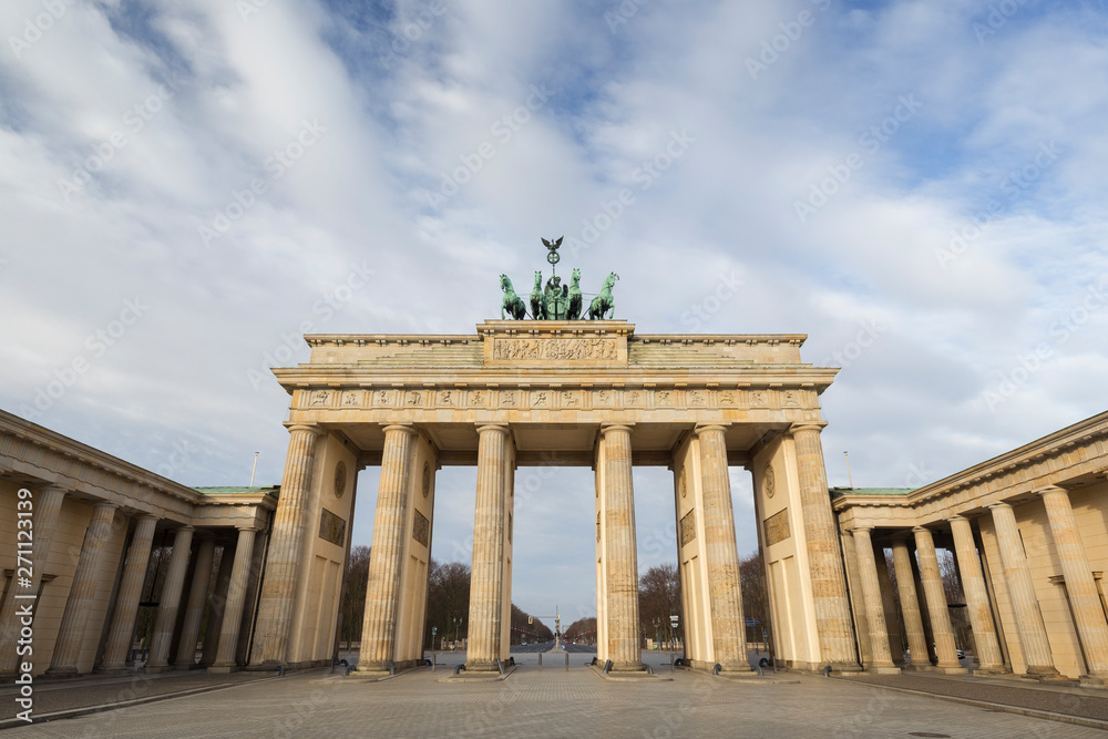 Front view of the famous neoclassical Brandenburg Gate (Brandenburger Tor) in Berlin, Germany, on a sunny day.