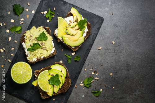 Sandwiches with avocado on black.