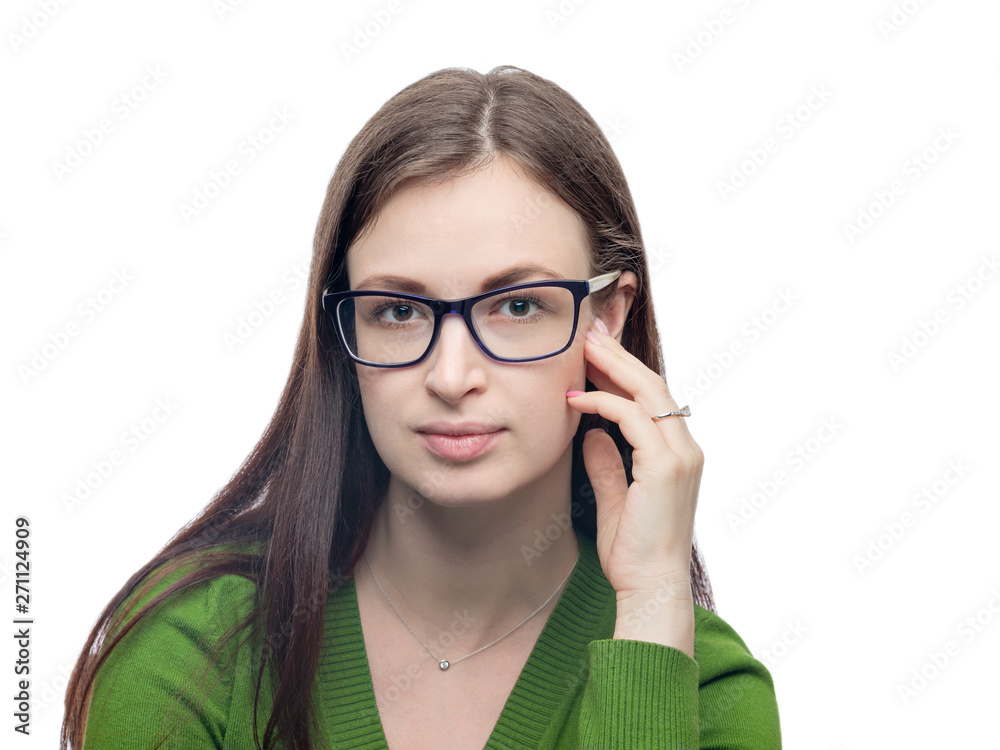 Young woman portrait. Pretty model in eyeglasses and green blouse looking at camera. Head shot. Studio image isolated on white. Young woman portrait. Pretty model in eyeglasses and green blouse looking at camera. Head shot. Studio image isolated on white.