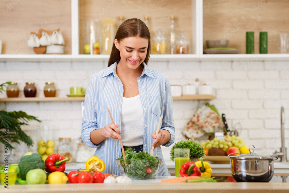 Healthy Eating. Woman Mixing Fresh Salad In Kitchen Healthy Eating. Woman Mixing Fresh Salad In Kitchen