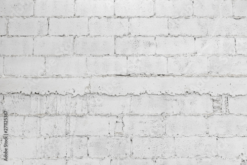 closeup of white decay brick wall abstract background wallpaper or web banner with copy space.