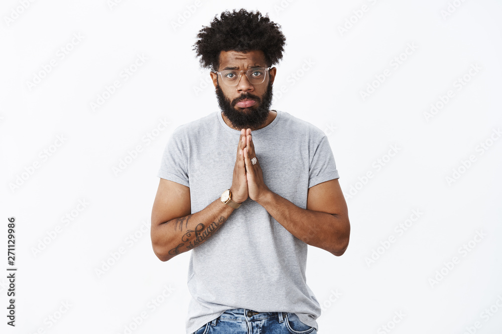 Sad and gloomy african american guy with pierced nose, tattoos wearing ...