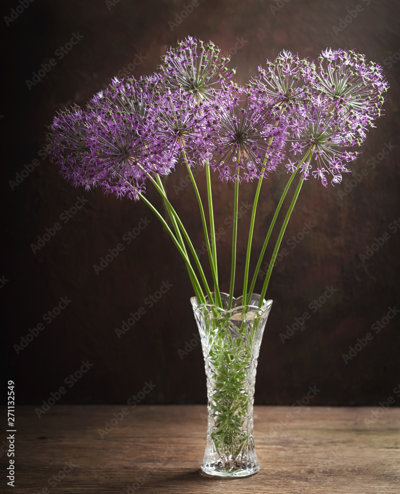 still life with bunch of purple allium flowers or ornamental onion