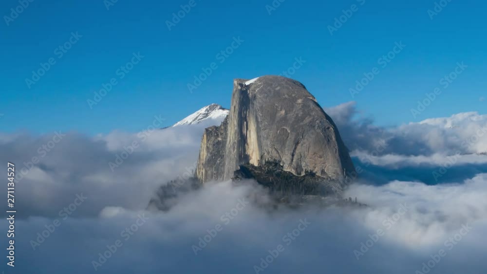 Aerial Yosemite National Park Cloudscape. Iconic Half Dome revealed as low clouds open up.