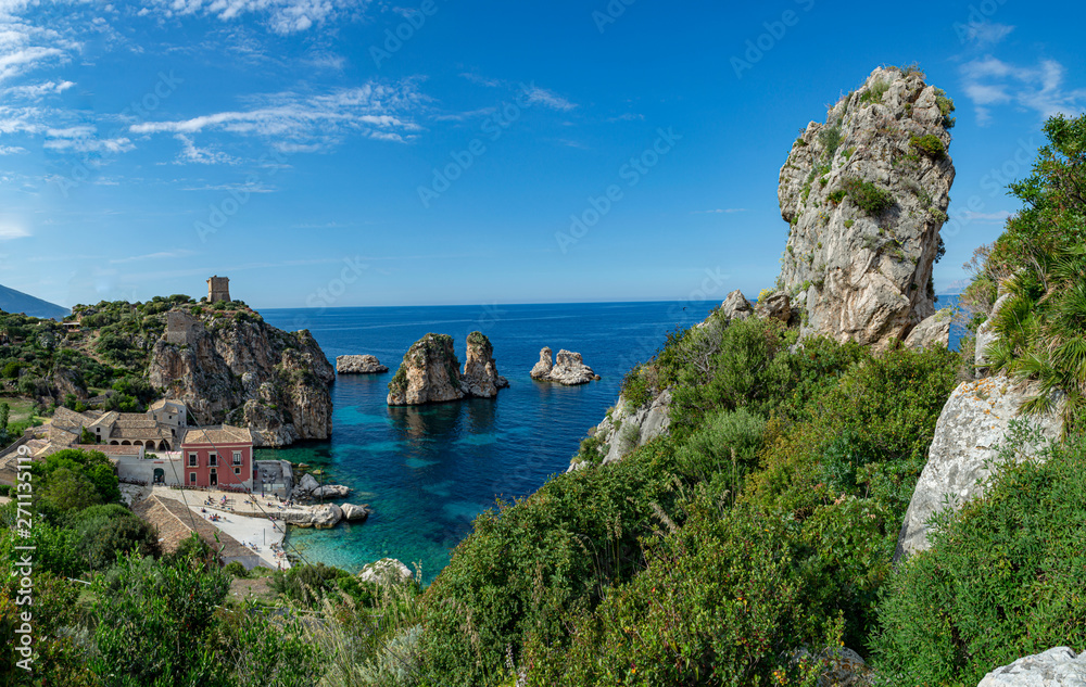 Coastline with rocks and deep blue sea near Castellamare del Golfo by entrance to natural reserve Zingaro, Sicily, Italy