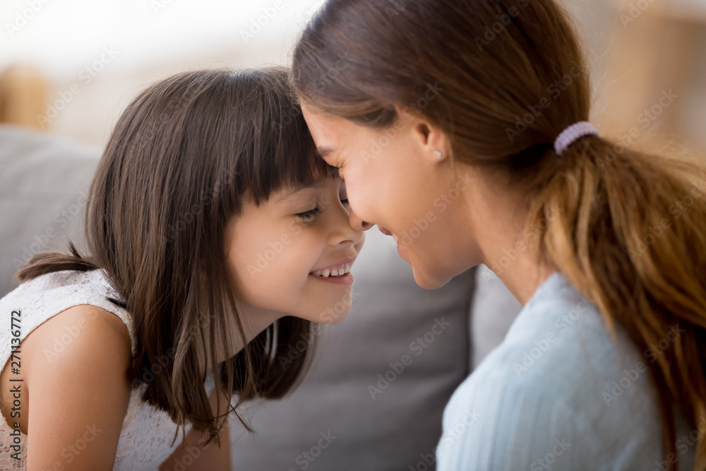 Loving young mom and little daughter enjoy sweet moment together Loving young mom and little daughter enjoy sweet moment together