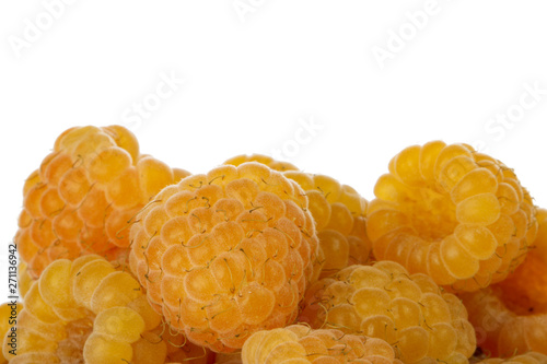 heap of yellow raspberries isolated on white background