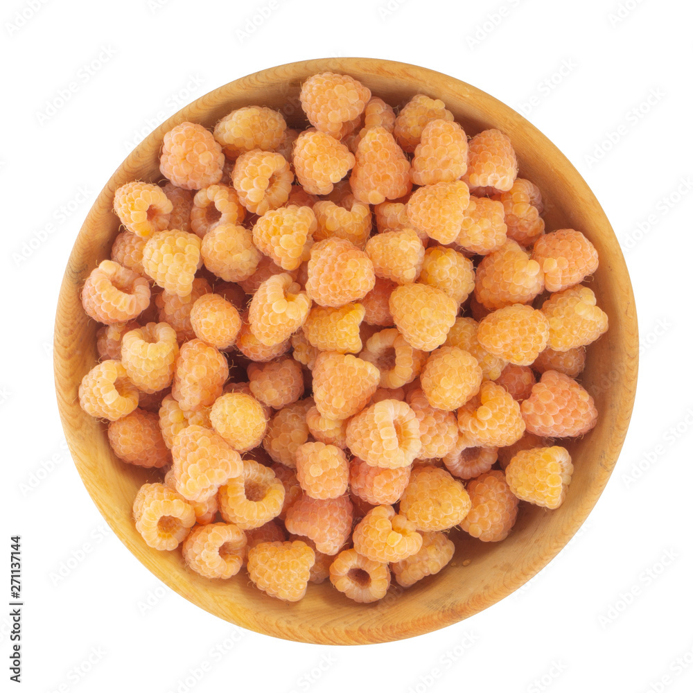 heap of yellow raspberries in wooden plate isolated on white background. top view