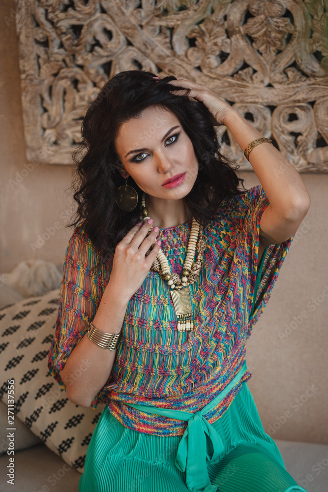Fototapeta premium Woman posing in traditional morrocan living room