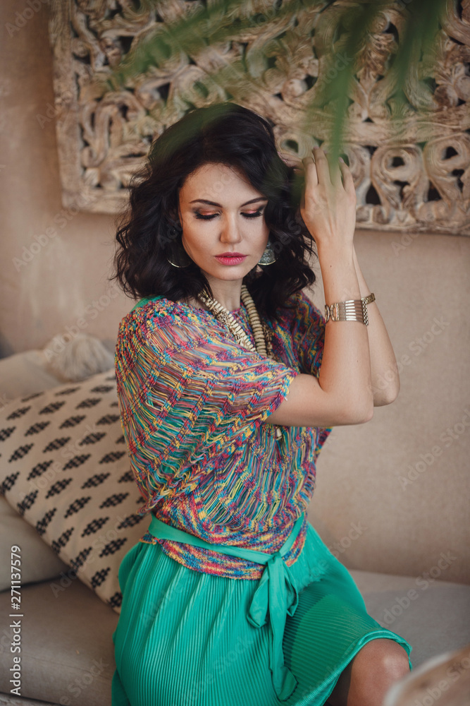 Fototapeta premium Woman posing in traditional morrocan living room