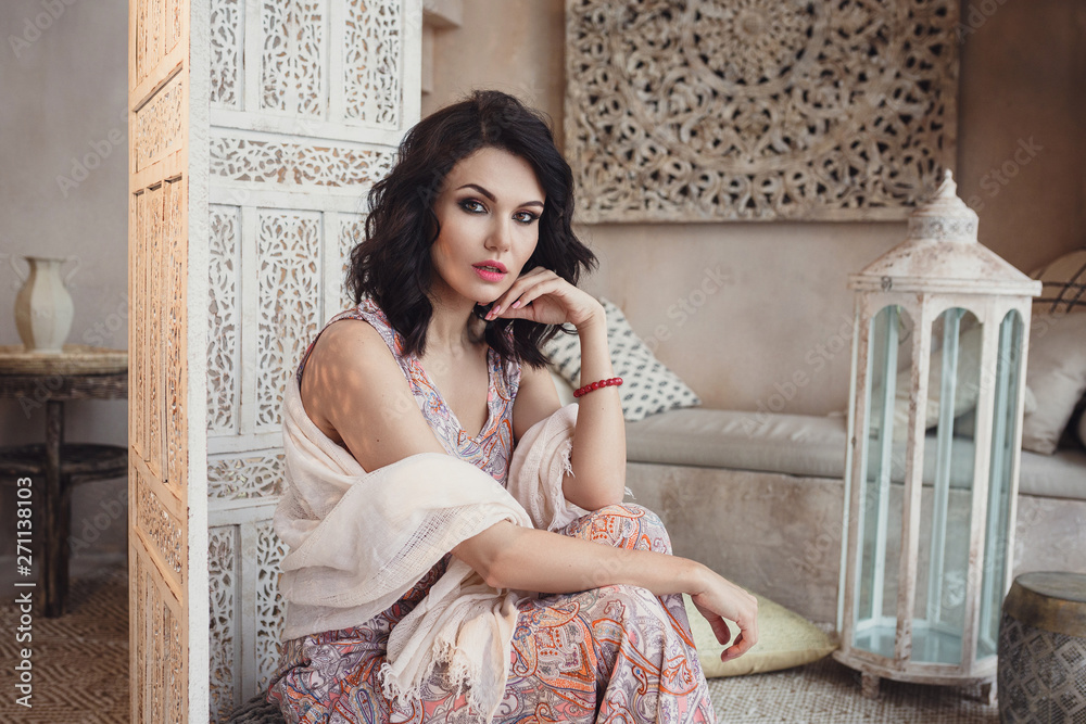 Fototapeta premium Woman posing in traditional morrocan living room
