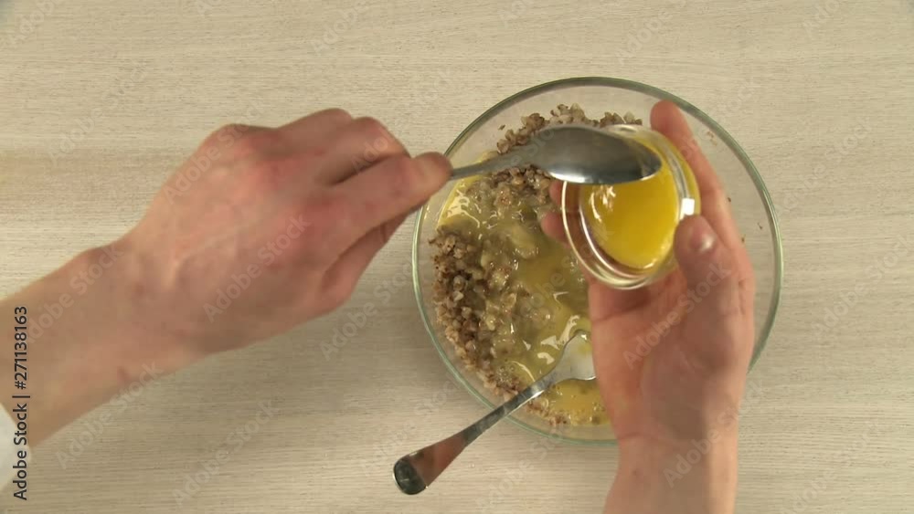 Cooker stirring eggs in a bowl video Cooker stirring eggs in a bowl video