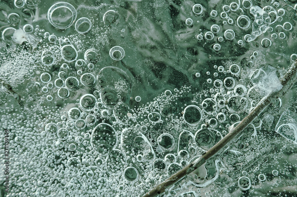 Texture abstract closeup background ice with bubbles of air caught by frost in the mass of water while freezing Texture abstract closeup background ice with bubbles of air caught by frost in the mass of water while freezing