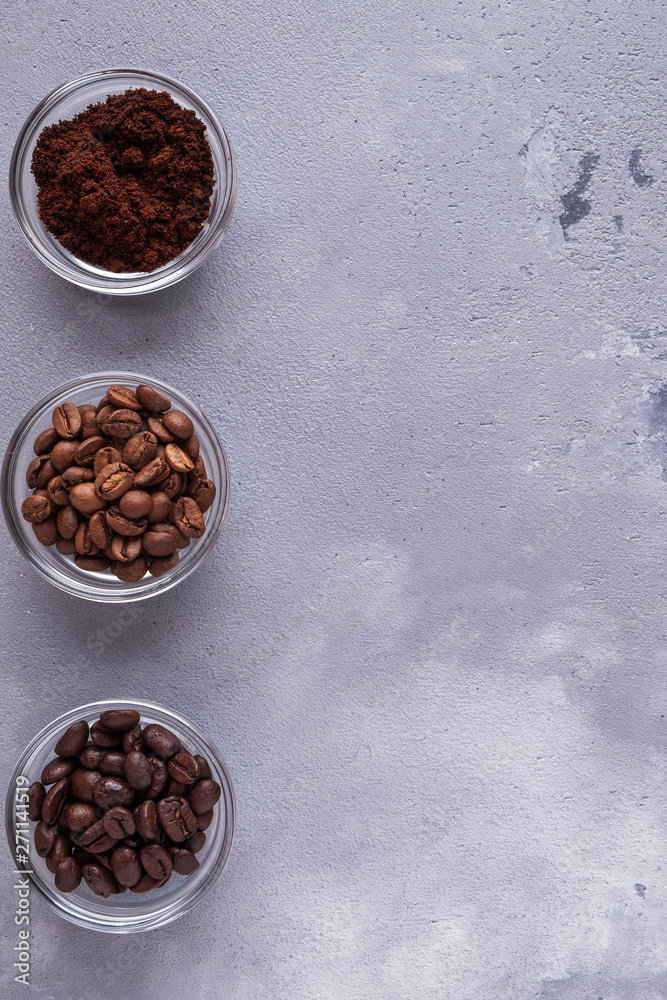 Top view of different varieties of coffee beans on dark background. Top view of different varieties of coffee beans on dark background.