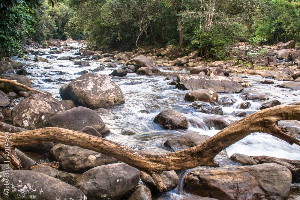 water racing through rocks to Guarau River in Peruibe, Brazil water racing through rocks to Guarau River in Peruibe, Brazil