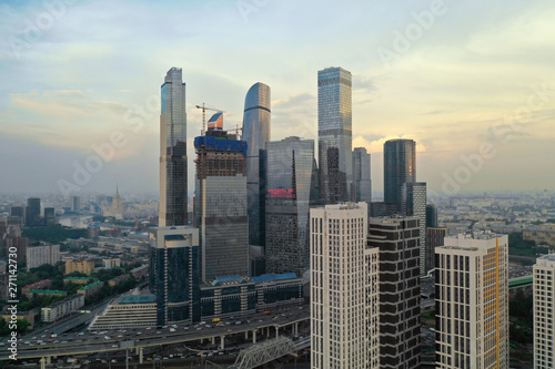 Aerial view of the skyscrapers of the business center of Moscow and highway at sunset