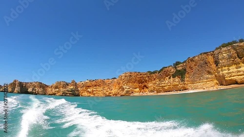View from motor boat on cliffs, and beach on Coast of Atlantic Ocean in Benagil, Algarve, Portugal