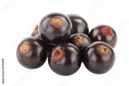 heap of black currants isolated on white background