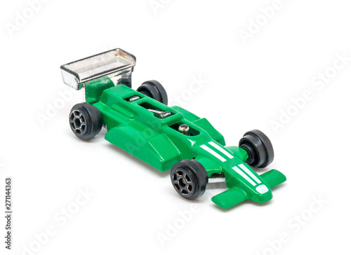 Photo of green toy model car isolated on white background