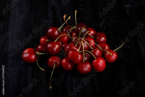 heap of cherry on wooden background