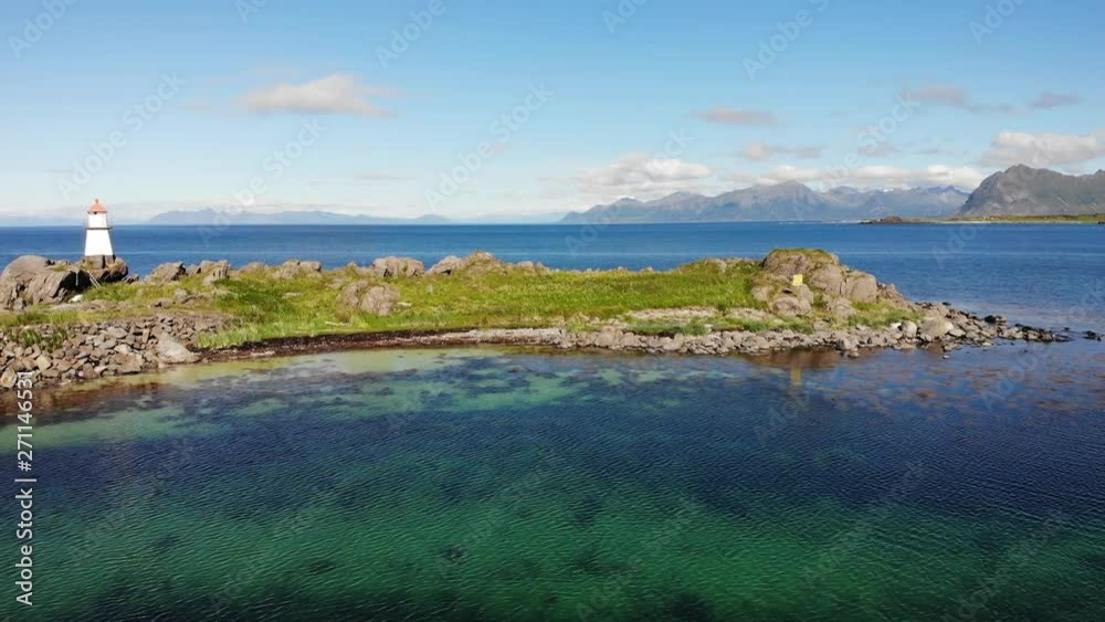 Lighthouse at Hovsund fishing port, Gimsoya Lofoten Islands in Norway Lighthouse at Hovsund fishing port, Gimsoya Lofoten Islands in Norway