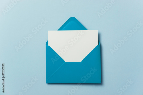 Blank white card with blue paper envelope template mock up photo