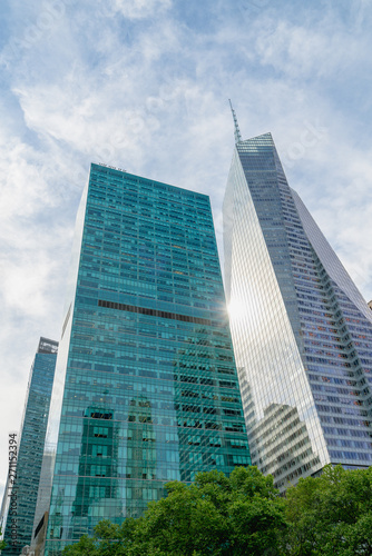 New York City Skyscrapers  Bright Sun  and Beautiful Cloudy Blue Sky