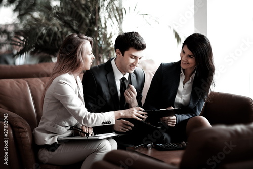 group of business people discussing the document in the Bank hall.