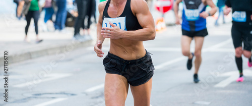 Unrecognizable muscular runner outdoors. Long distance running