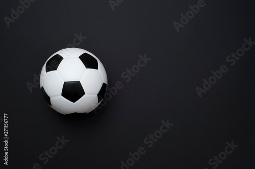 soccer ball or football on black background