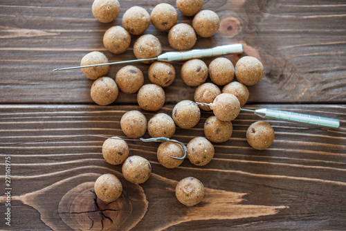 Carp baits on a wooden background.