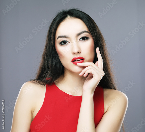 lifestyle and people concept - Young beautiful asian woman wearing red dress