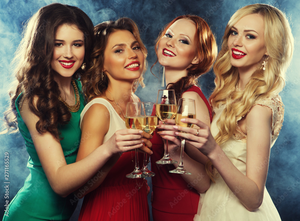 lifestyle, party and people concept - Group of partying girls wearing dress, with sparkling wine