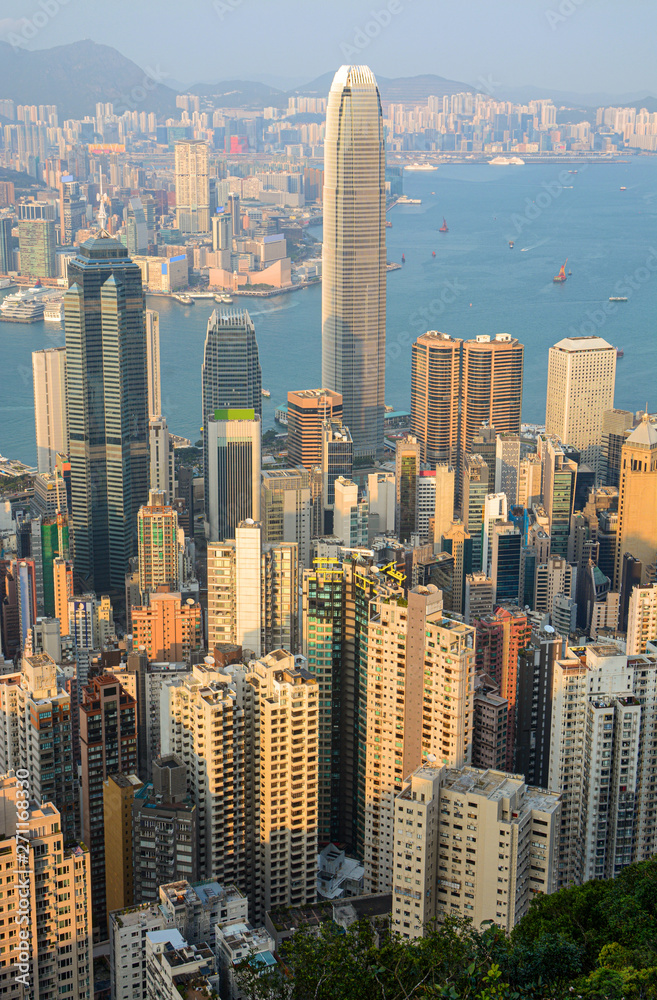Fototapeta premium Tall skyscraper buildings in Hong Kong's busy Central District at sunset